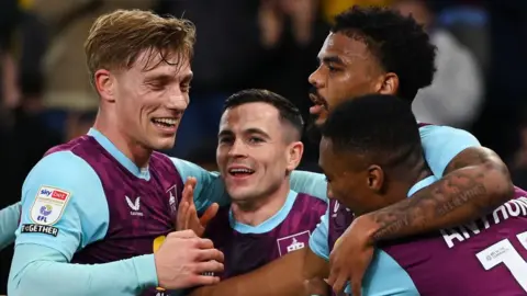 Josh Cullen (second from left) celebrates after Michal Helik turned his cross in for an own goal 