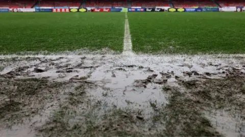 A waterlogged football pitch. 
