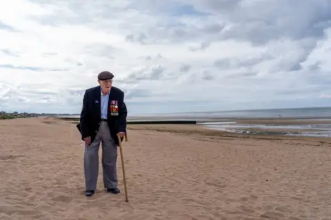 Jordan Pettitt/PA Media Veteran Jack Mortimer returns to Sword Beach in Normandy, France, where he landed on D-Day
