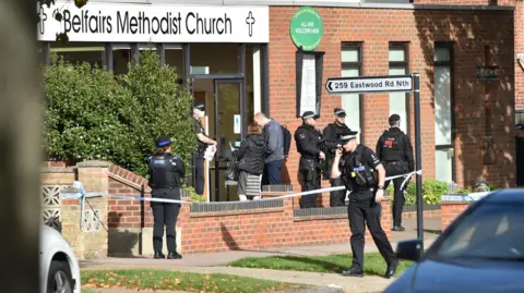 PA Media Armed police officers outside the Belfairs Methodist Church in Eastwood Road North, Leigh-on-Sea, Essex.