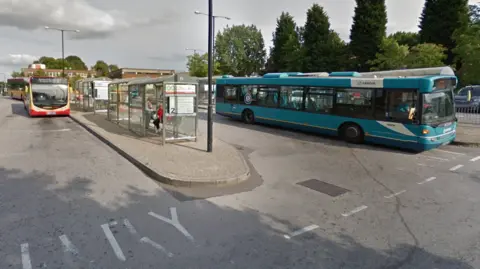 Buses waiting at Swadlincote Bus Station, in Derbyshire.