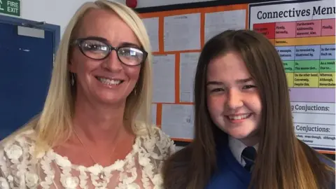 Lily Dowling whose life was saved with an adrenaline pen, with her mum Sara