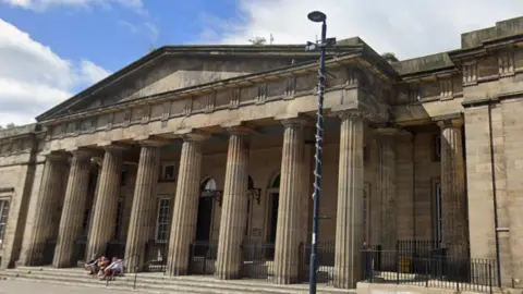 The exterior of Perth Sheriff Court, a large court building with pillars at the entrance