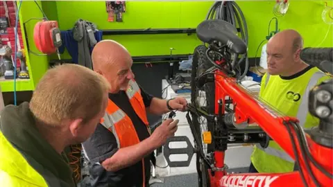 Go charity A photo of the bikes being repaired