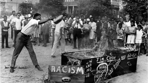 Boston Globe via Getty Images A Burial Burning of Jim Crow on June 11, 1967