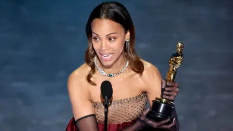 Getty Images Zoe Saldaña accepts the award for Best Actress in a Supporting Role for 