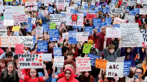 Reuters People demonstrate in Legislative Plaza to call for an end to gun violence and support stronger gun laws, after a deadly shooting at the Covenant School in Nashville, Tennessee, U.S., April 3, 2023.