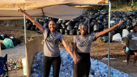 In terms of courtesy, good human beings 268 kilos and Joshuanite present a picture in front of a pile of plastic bottles that they collected for recycling