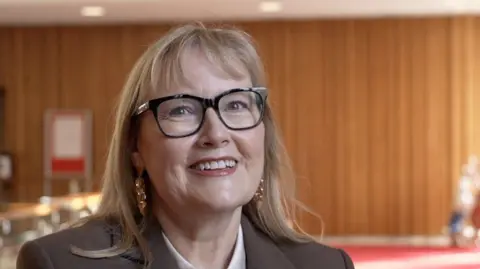 Newcastle City Council leader Karen Kilgour. She has mousey blonde hair and is wearing black-rimmed glasses.