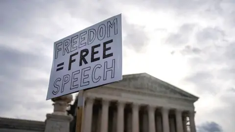 Reuters A protester outside the US Supreme Court with a placard reading "Freedom equals free speech"