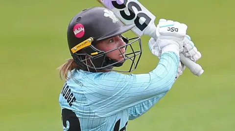 Danni Wyatt-Hodge hits the ball down the ground for Surrey
