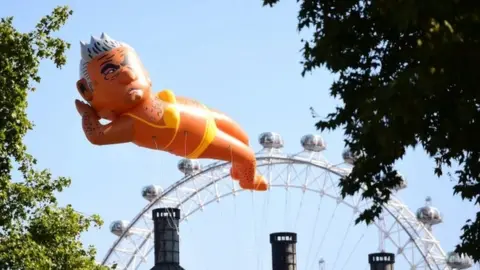 David Mirzoeff/PA Wire Sadiq Khan balloon