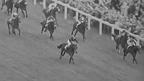 British Pathé Black and white photo of horses racing