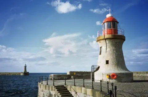 Marco Rosario Venturini Autieri/ Getty Images South Shields Pier has a small light house at the end of it over looking the ocean.