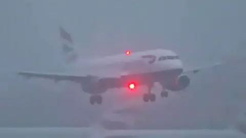 Flight landing in foggy weather at Heathrow