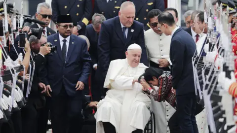 EPA Pope Francis is welcomed during his arrival at Soekarno-Hatta International Airport in Jakarta