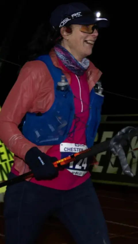 A woman pictured in running gear 