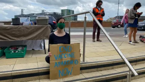 Protester at AstraZeneca HQ in Cambridge