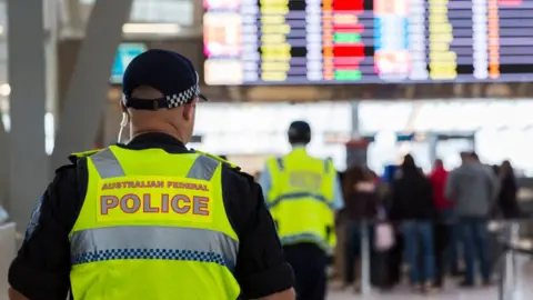 Getty Images A police officer in an airport