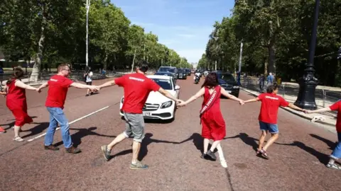 PA Media Protesters block Boris Johnson's car