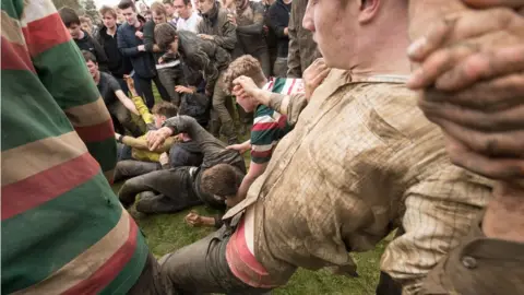 PA Competitors fight for the bottle on the ground