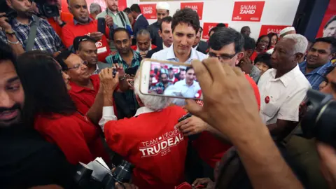 Getty Images Trudeau with fans in Toronto