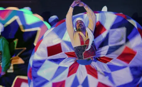 EPA Members of the 'Tanoura Dance Troupe' perform during the holy month of Ramadan, at the Ghouri complex, in Islamic Cairo, Egypt, 05 April 2023