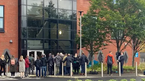 Press outside policing board