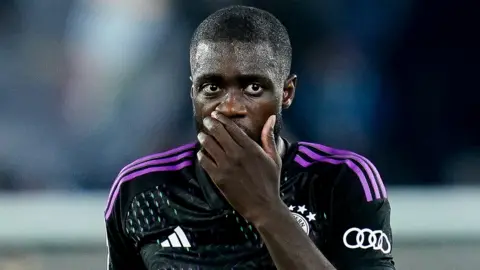 Bayern Munich defender Dayot Upamecano reacts after being sent off against Lazio in the Champions League last-16 first-leg tie
