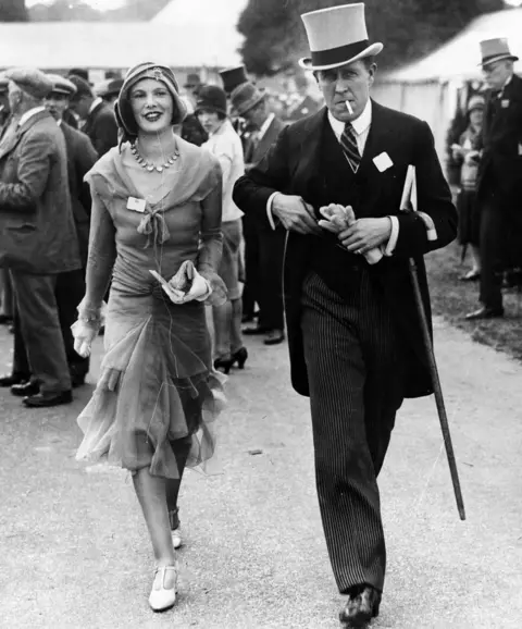 Getty Images A photo from the Hulton Archive: "Mr and Mrs Ronald Armstrong Jones, wearing formal dress as they attend Royal Ascot, circa 1945."
