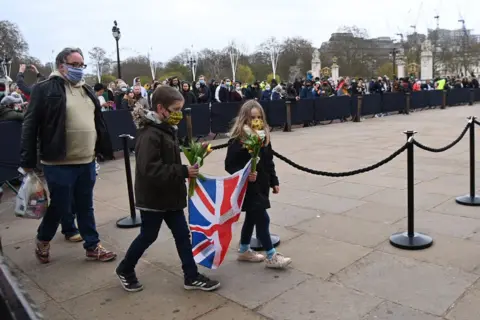 EPA People gather outside Buckingham Palace a day after the passing of Britain's Prince Philip, Duke of Edinburgh, in London, Britain, 10 April 2021.