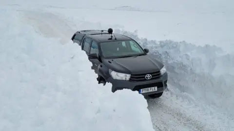 Cawdor Estate Truck passing snow drifts on Cawdor Estate