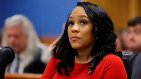 Getty Images Fulton County District Attorney Fani Willis arrives for the final arguments in her disqualification hearing at the Fulton County Courthouse on March 1, 2024, in Atlanta, Georgia