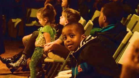 Jon Behm/The Cedar Children from the Cedar-Riverside neighbourhood watch the recording of the Ubadkaa Mudnaanta Leh album