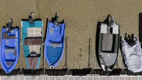 EPA Boats on the dried out shore of Brenet Lake