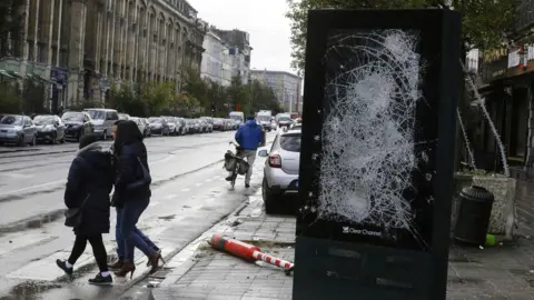 AFP/ Getty Images glass front of street ad smashed