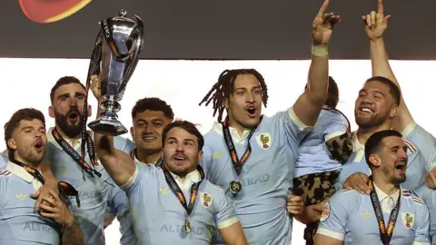 France players lift the Six Nations trophy after the 48-46 win over England