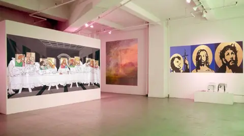 Contributed An art exhibition where several pieces of work show scenes from the Bible like the Last Supper and images of Jesus.