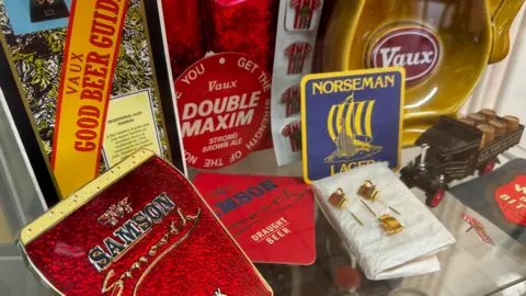 Beer memorabilia in a glass cabinet