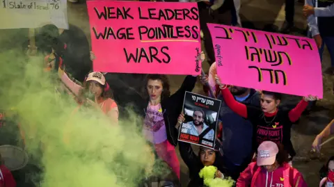 Reuters People protest against the Israeli government's failure to bring home hostages held by Hamas in Gaza, in a protest in Tel Aviv, Israel (11 January 2025)