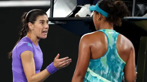 Sorana Cirstea and Naomi Osaka exchange words at the end of their Australian Open match