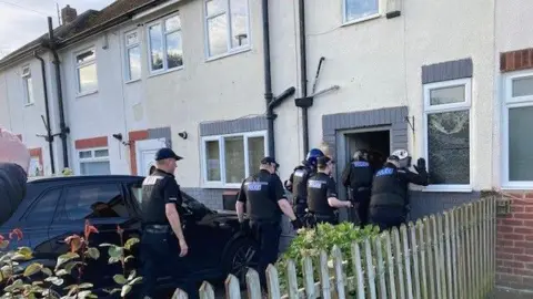 BBC Officers raiding a house