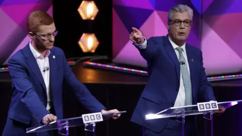 Getty Images Ross Greer, on the left, and Malcolm Offord during the debate.