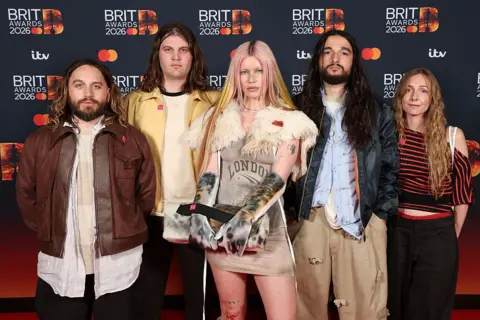 Getty Images Ellis Durand, Henry Holmes, Rhian Teasdale, Josh Mobaraki and Hester Chambers of Wet Leg