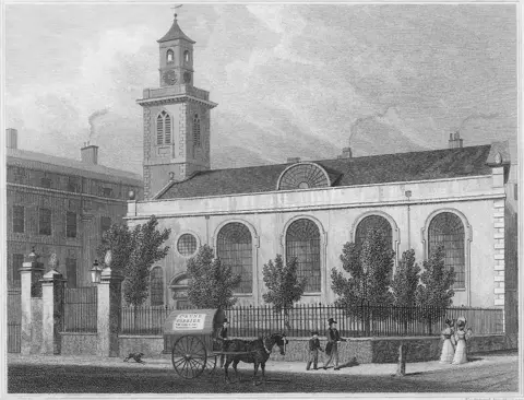Getty Images Black and white engraving of St Mary Aldermanbury in 1828 with a horse and carriage and people walking on a road in front of the railings surrounding it