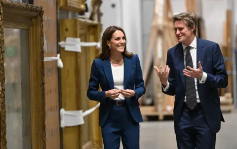 PA Media The princess was shown around the storehouse by museum director Tristram Hunt