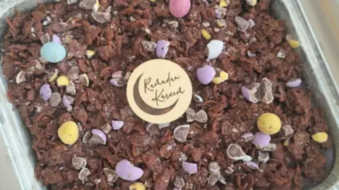 Aisha Sadiqa A cake with a Ramadan greeting on it that reads Ramadan Kareem.