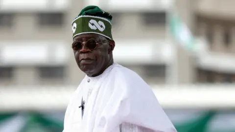 Reuters Nigeria's President Bola Tinubu looks on after his swearing-in ceremony in Abuja, Nigeria on 29 May, 2023.