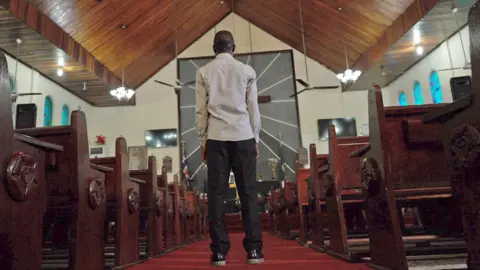 BBC/Gift Ufuoma Peterson Sonyah in St Peter's Lutheran Church in Monrovia, Liberia