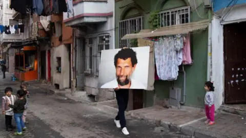 Ates Alpar Turkish artist Ates Alpar took a portrait of Osman Kavala around Istanbul to highlight his four years in jail